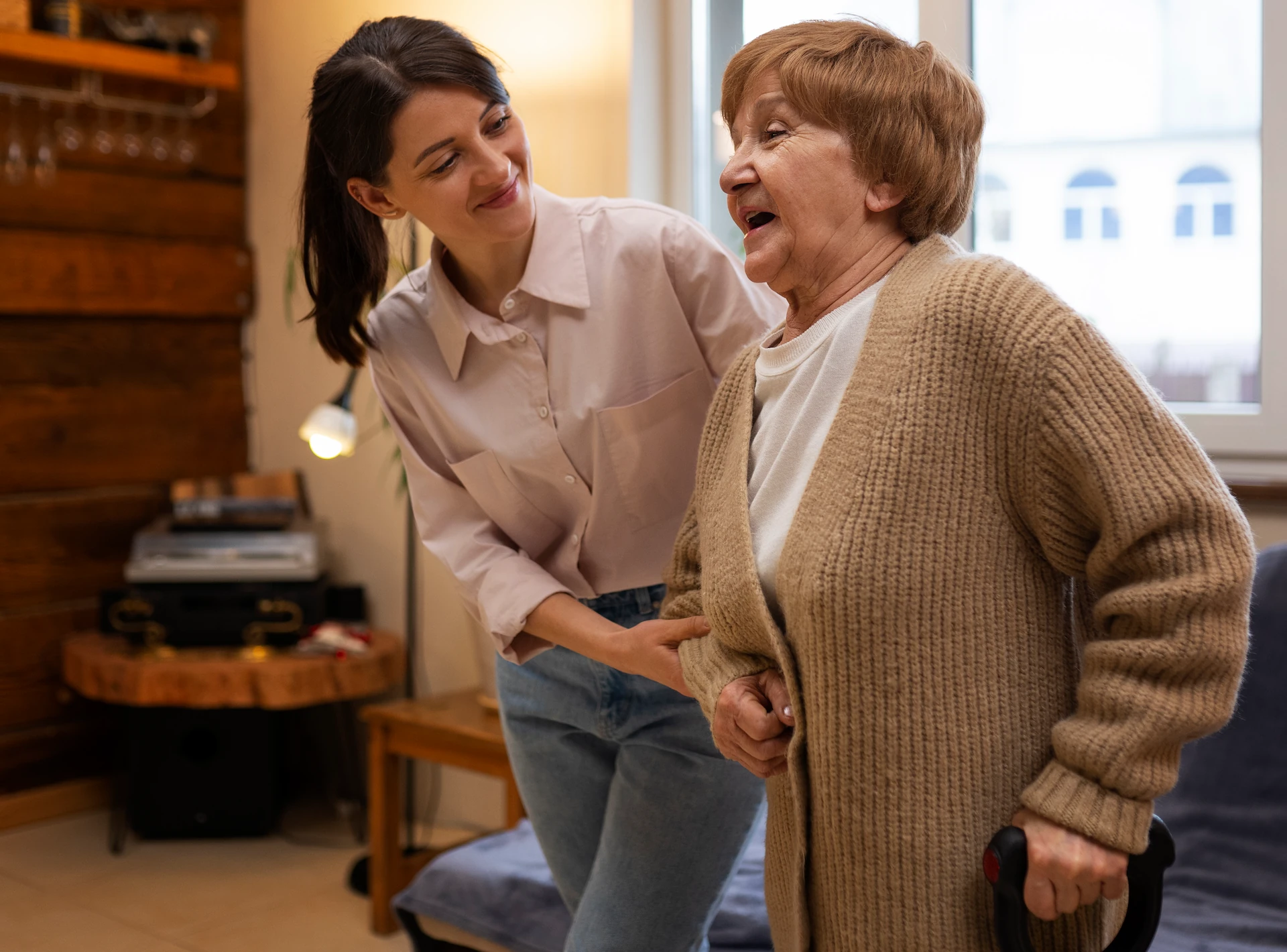 female caretaker her client s house taking care elderly person