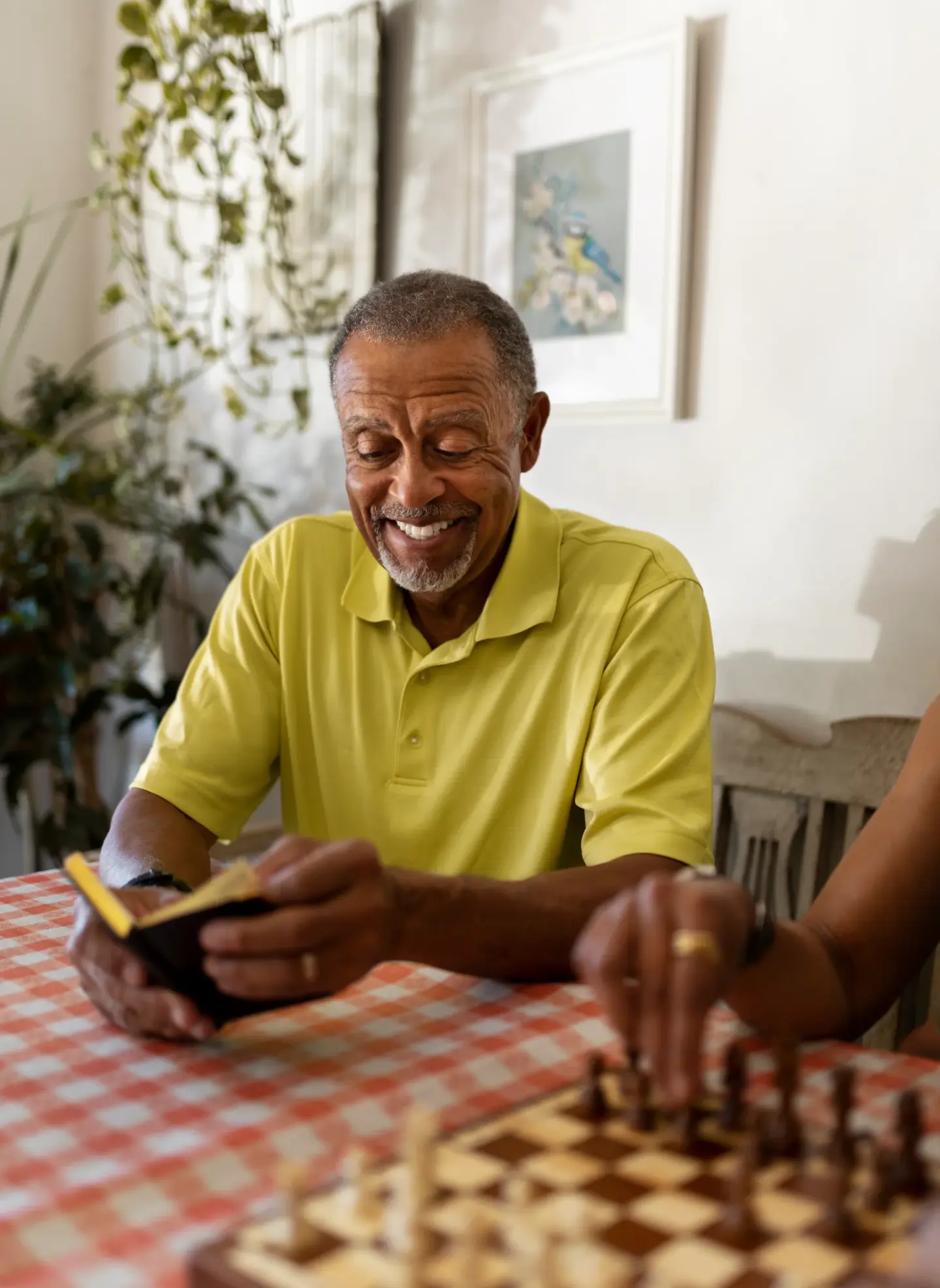 smiley senior man holding notebook